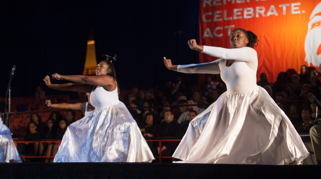 Dancers perform on stage
