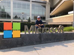 Eldon Tsoi poses with a Microsoft sign.