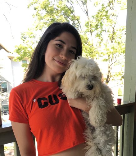 Isa Borrero holds her therapy dog Lilo 
