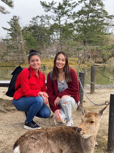 Melody and friends posing with a deer 
