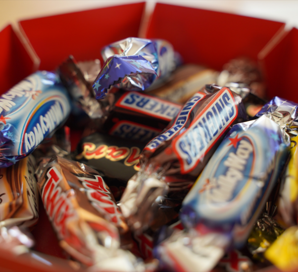 Miscellaneous fun-size candy bars in a basket
