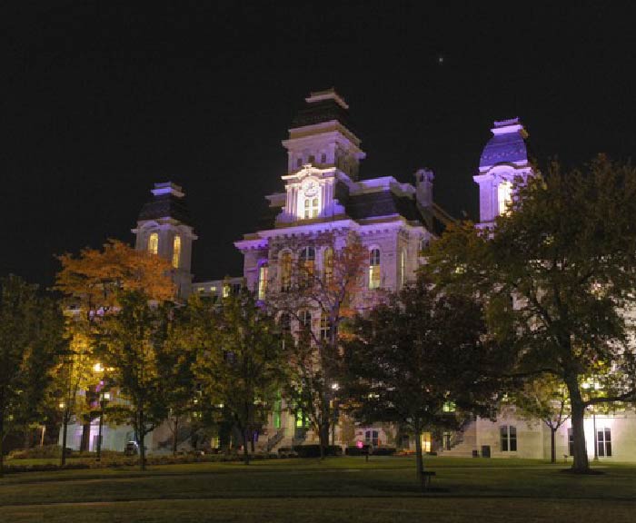 The Hall of Languages lit purple at night for Domestic Violence Awareness Month