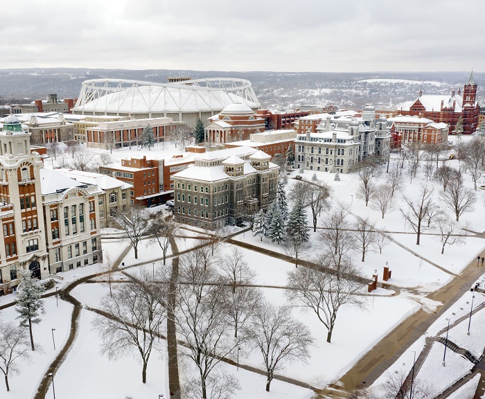 An aerial shot of the Syracuse University campus covered in snow