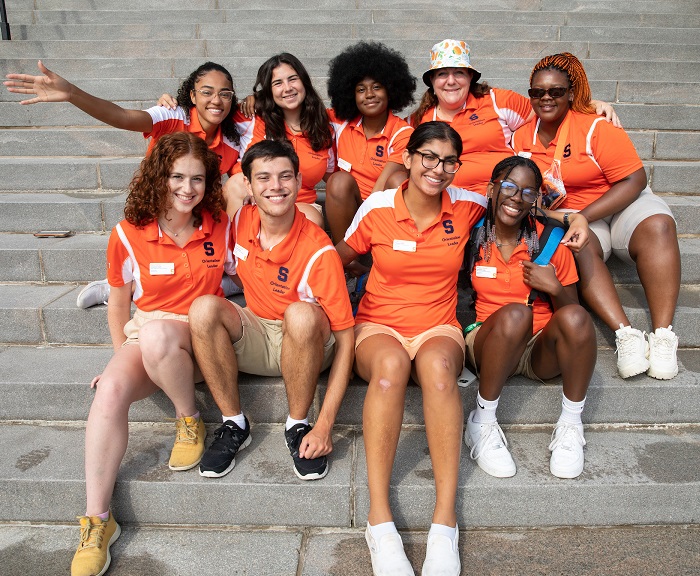 2022 Orientation Leaders sit together on the steps of Hendricks Chapel