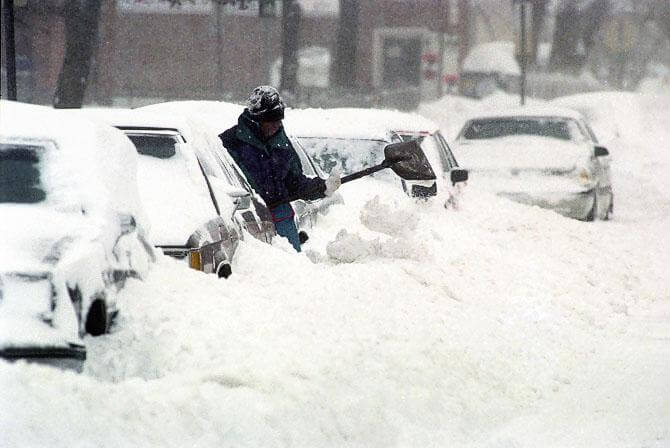 Someone shovels snow after a snowstorm in Syracuse in 1993