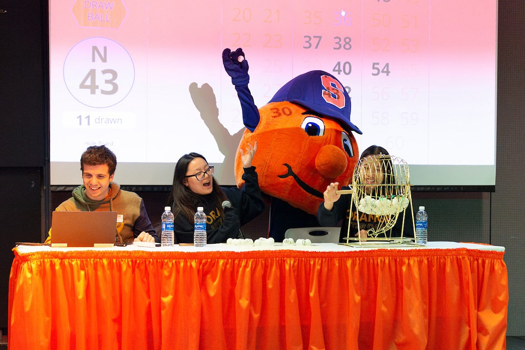 Otto the Orange helps "call" numbers at an Orange After Dark bingo event.