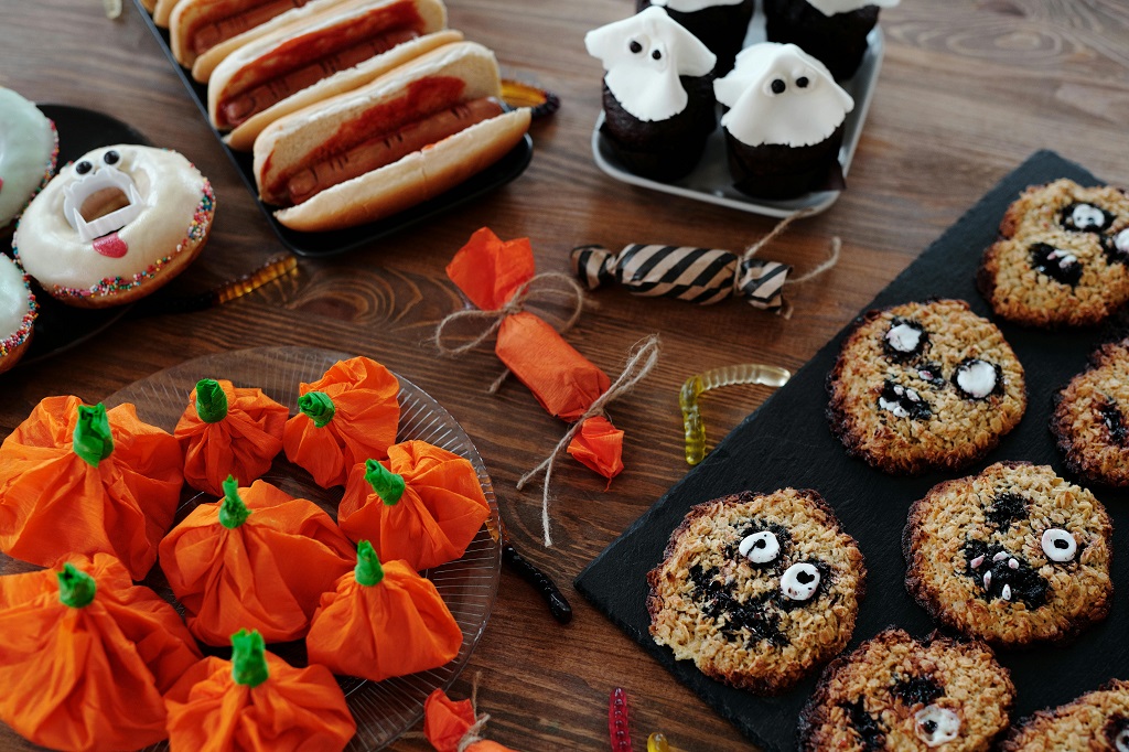 A table full of Halloween snacks and food