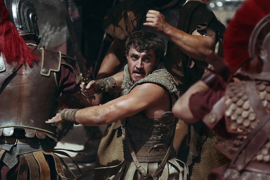 Screenshot from "Gladiator II" with Paul Mescal's character surrounded by Roman soldiers.