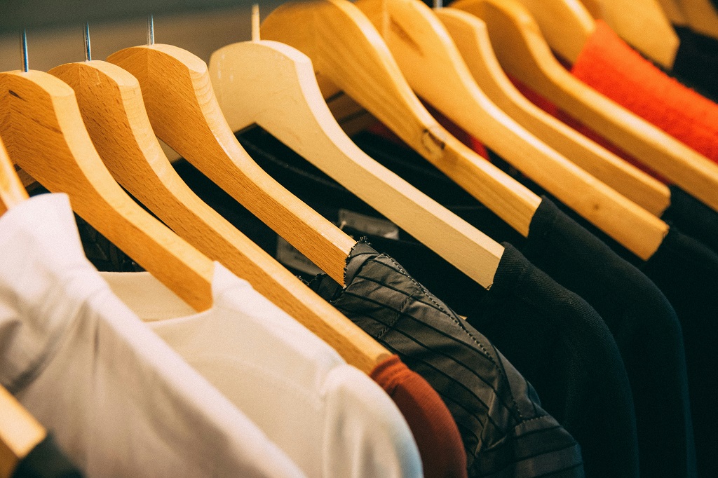 Clothes hanging in a closet.