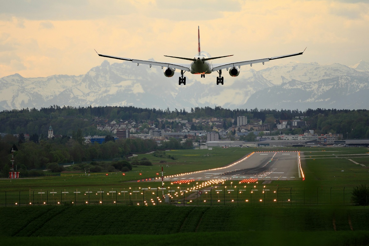 A plan landing on a runway.