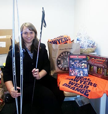 SPIN Auction Director andsecond-year law student Casey Hildonen organizes auction items for the Nov. 15 event.