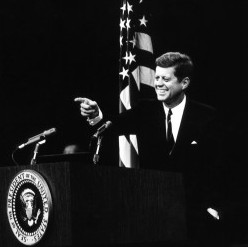 Kennedy at a press conference Image source: Wikimedia Commons 
