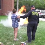 An RA is trained in the proper use of a fire extinguisher as part of the fire safety training day.