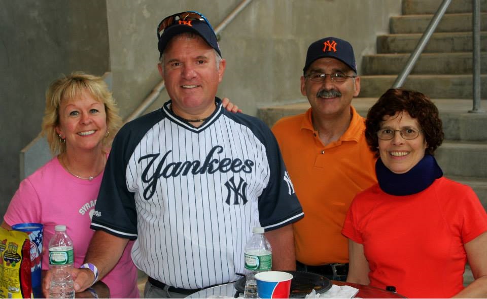 SU-Yankee day on June 21 brought five busloads of fans from Syracuse to Yankee Stadium, including, from left, Denneva Calkins, administrative assistant, Vice Chancellor’s Office; Doug Freeman, director, Purchasing and Real Estate; Steve Karpinko, sergeant, Department of Public Safety; and Gretchen Goldstein, executive administrator for correspondence and communication, Chancellor’s Office. 