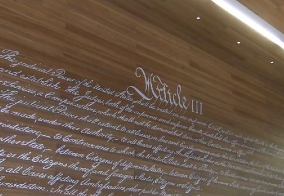 Article III of U.S. Constitution located on wall of reading room at Dineen Hall.