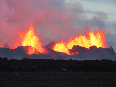 A lava fountain at the volcano's central vent, known as "Baugur" (Icelandic for "ring" or "circle").