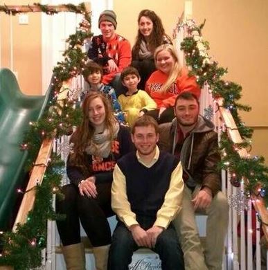 Julian's elves join him on the stairs after decorating his house for the holidays. Top row, from left: Tyler Patchet and Emily Gramlich; middle row, from left: Julian Ross, his brother Bray and Shannon Mowles of Mansfield; bottom row, from left: Hannah Berman, Eric Gallanty and Chris Torres 