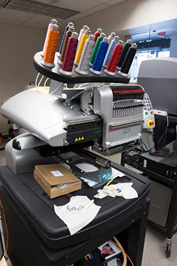 MakerSpace's large embroidery machine is capable of stitching 16 colors at one time.