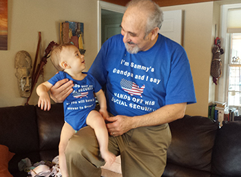 Eric Kingson and grandson Sammy show their support for Social Security.