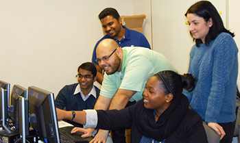 iSchool students work in the Global Enterprise Technology Center in Hinds Hall. From left to right, Ashay Jawale, Gerald Jamar Smith, Samarth Shivaramu, Olevia Mitchell, and Eleni Dimitriou.