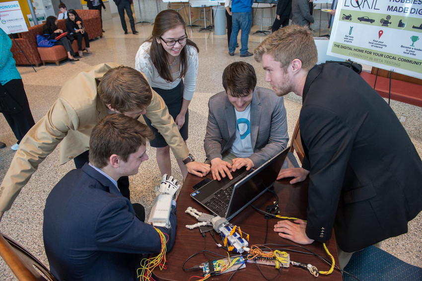 Members of the Contact team, which won sdfasdfasdf, demonstrate the functionality of their prototype.