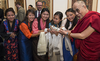 Syracuse University team, l-r students Rinchen Dolma, Tenzin Lama, Tenzin Kusang, Norzom Lama, Pasang Lhamo, and Michael Wohl (back) pose with the Dalai Lama after their second place finish.  //Tibetan spiritual leader the Dalai Lama meets participants in the national finals of the Tibetan Innovation Challenge, a new intercollegiate social entrepreneurship business plan contest, organized by the University of Rochester, intended to improve the lives of Tibetans living in refugee camps in India, at the Tibet House US in New York City July 11, 2015.  // photo by J. Adam Fenster / University of Rochester