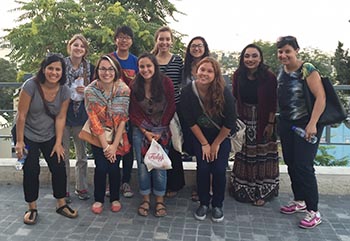 Professors Dana Olwan (far left) and Carol Fadda-Conrey (far right) pose with students during "Global Perspectives."  