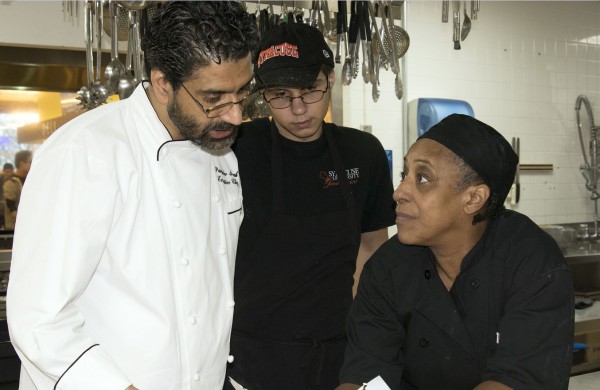 Executive Chef Parvinder Singh with temporary employee Tyler McJilton and Joyce Burwell, First Cook