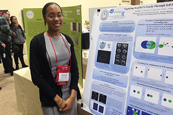 Kassidy Lundy with her poster, “Exploring Kupffer’s Vesicle through Self Propelled Particle Simulations,” at the CSTEP conference