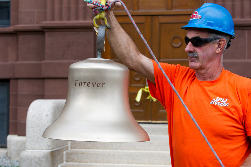 A worker with bell