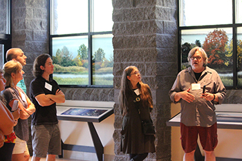 Religion Department chair Philip Arnold and his wife, Sandy Bigtree, speak to middle and high school teachers during a workshop on the ecology and history of Onondaga Lake. 