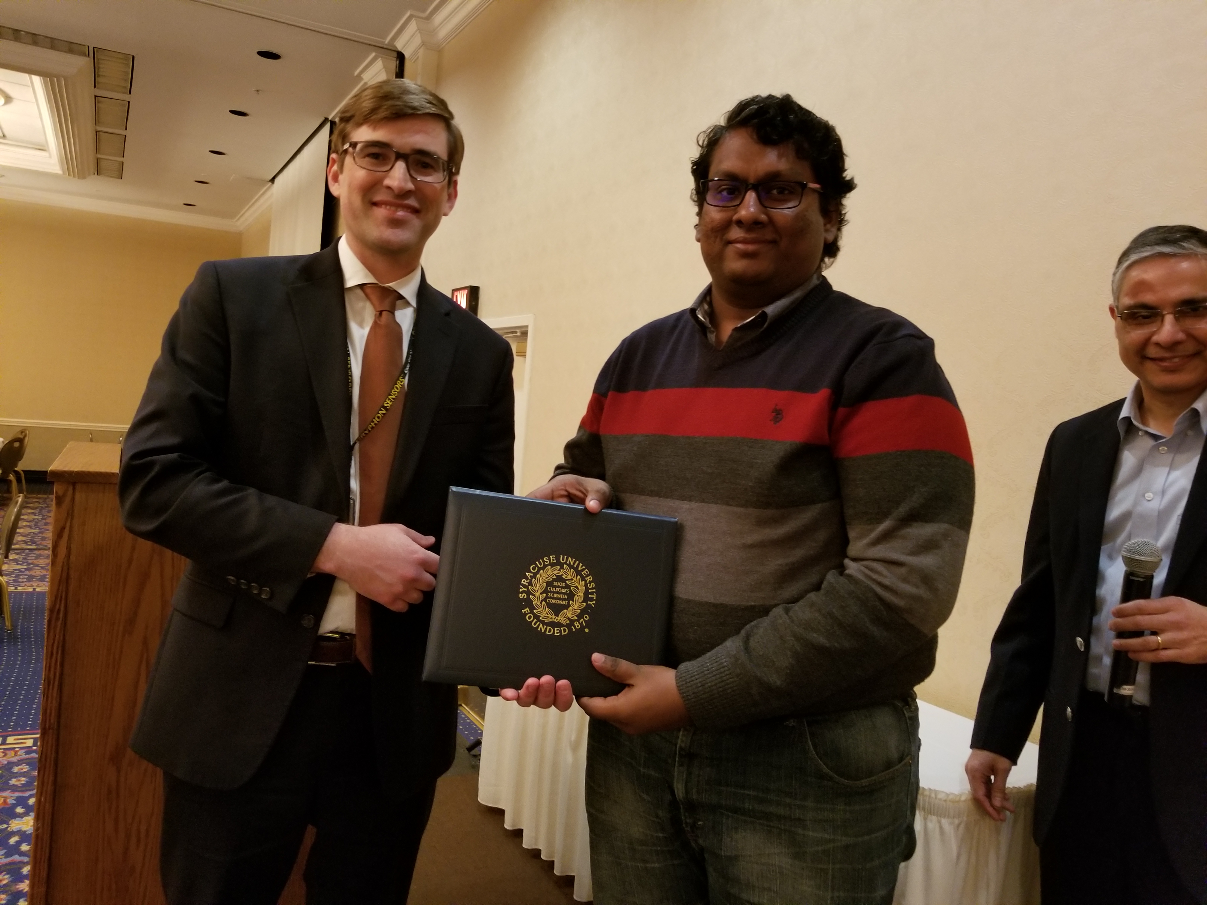 Graduate Student Pitch Competition Winner Flaviyan Jerome Irudayanathan with judge Craig Marcinkowski from Gryphon Sensors.