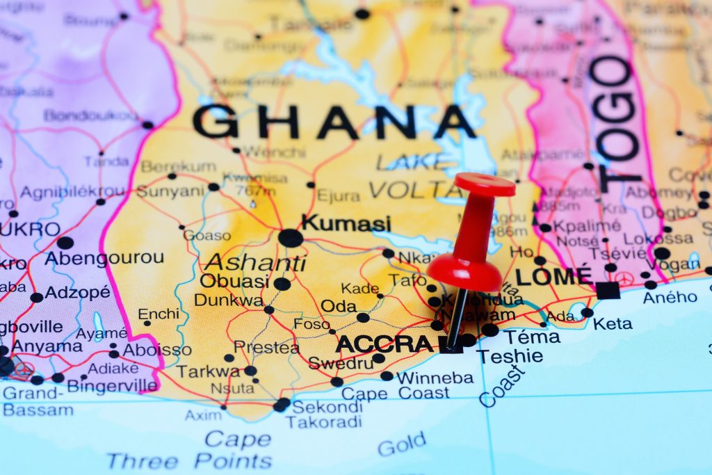 Photo of pinned Accra on a map of Africa. 