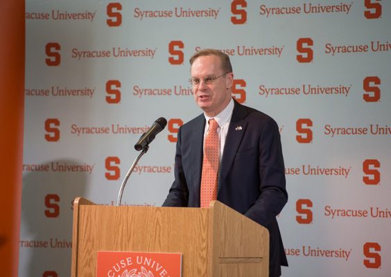 Chancellor Kent Syverud speaking in front of podium and microphone