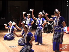 female dancers dressed identically, doing arm movements