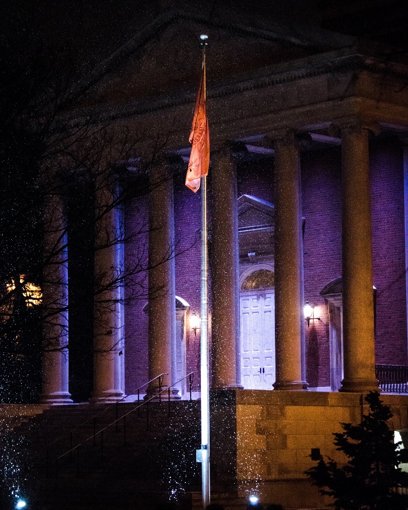 flag pole at night in front of Hendricks 