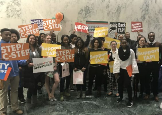 people standing with signs