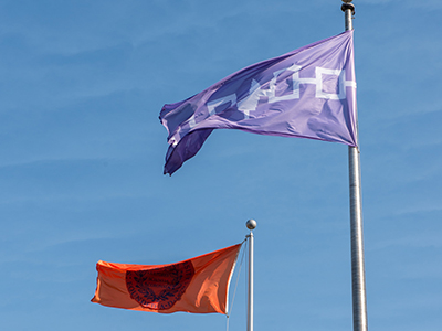 The Haudenosaunee flag flies alongside the SU flag on the Quad.