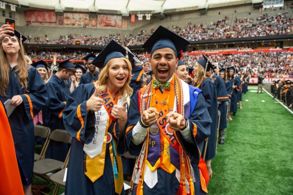 two people in graduation gowns