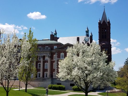 Maxwell Hall with blooming trees in spring