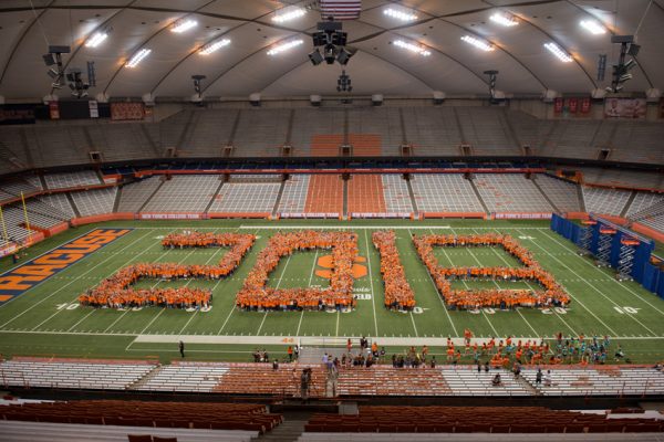 crowd of students form numbers 2018 on Carrier Dome field