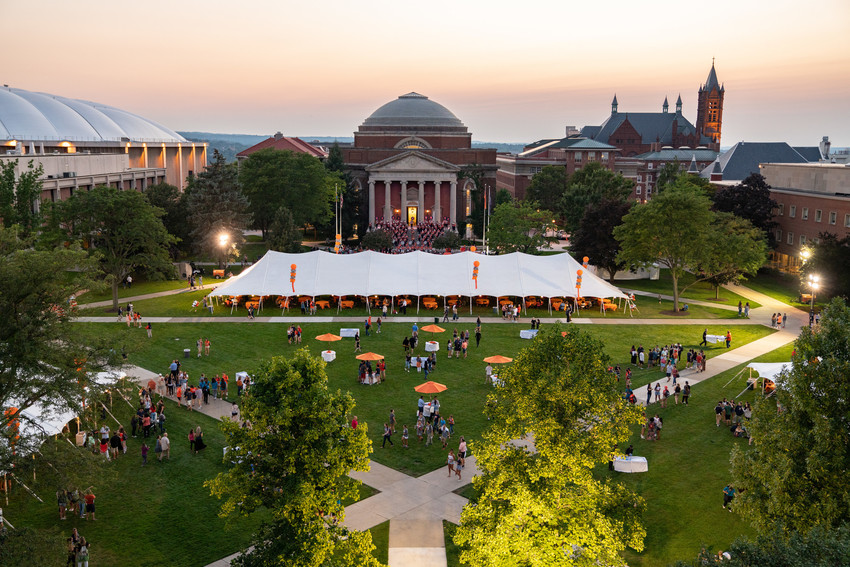 a giant tent on the Quad at dusk