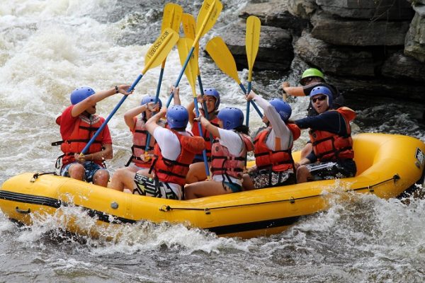 people rafting on boat