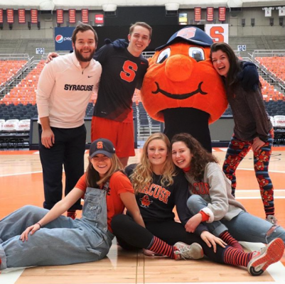 Students on the Otto mascot team pose with Otto in the Dome