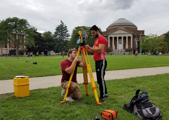 Two students surveying the quad.