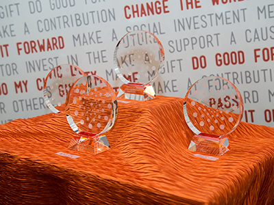 Three Orange Circle Awards on a table