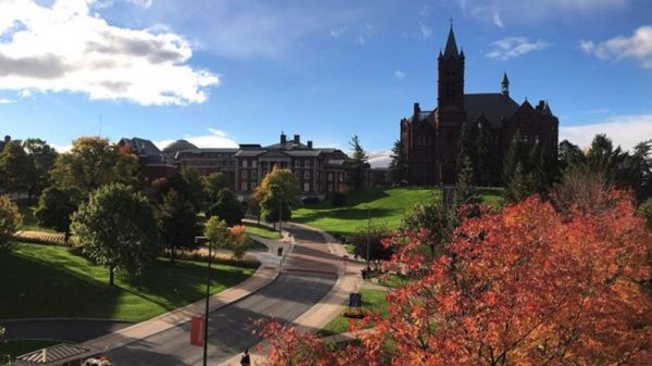 campus buildings with changing leaves