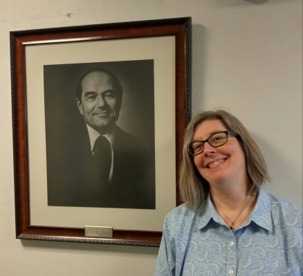 Diane Wiener, with a portrait of Burton Blatt