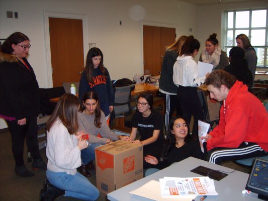 Social Work students assemble donation boxes for 2018 food drive