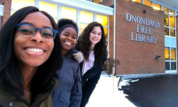 iSchool seniors Kahssia Hills, Malaika Howard and Sydney Paul outside the Onondaga Free Library, where they helped start a new chapter of Girls Who Code.